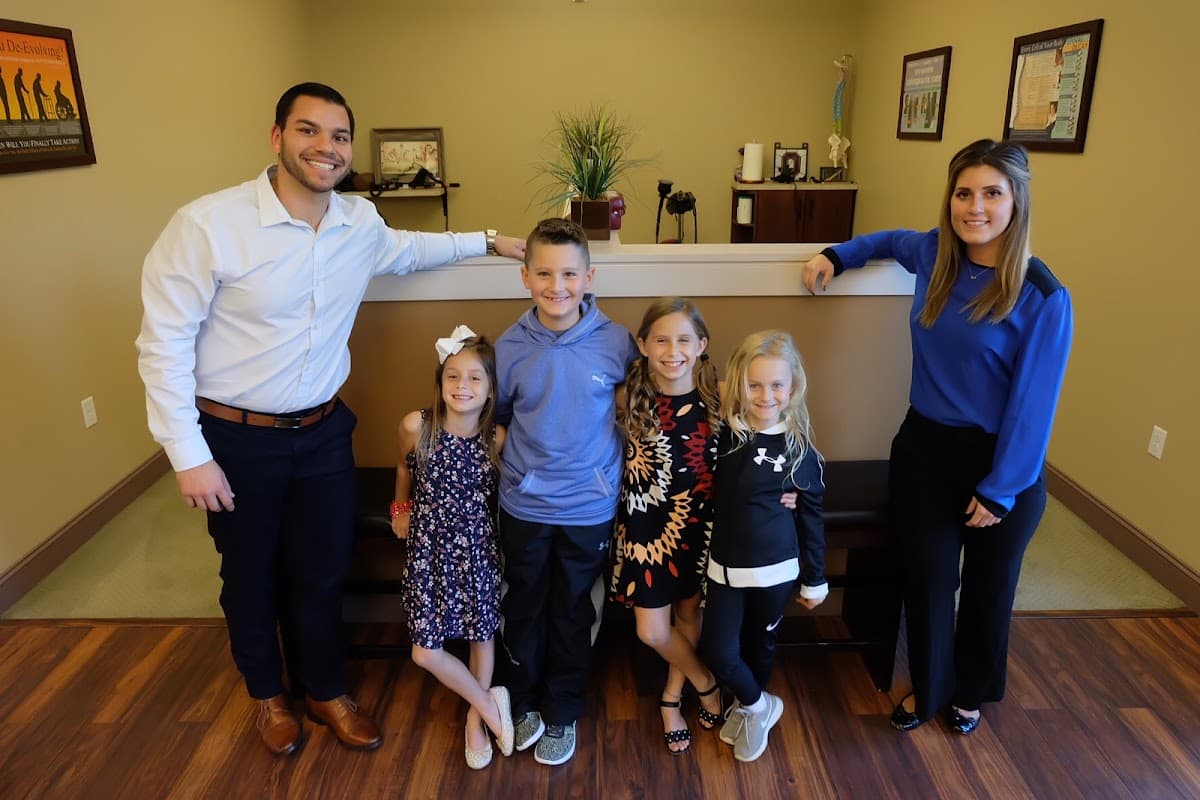 A family visiting the Explore Family Chiropractic office in Aurora, Ohio